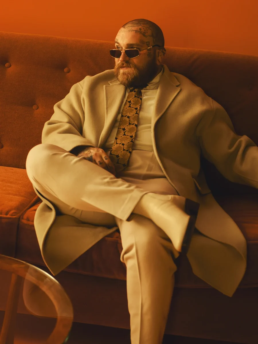 Teddy Swims seated in a promotional portrait from 2023