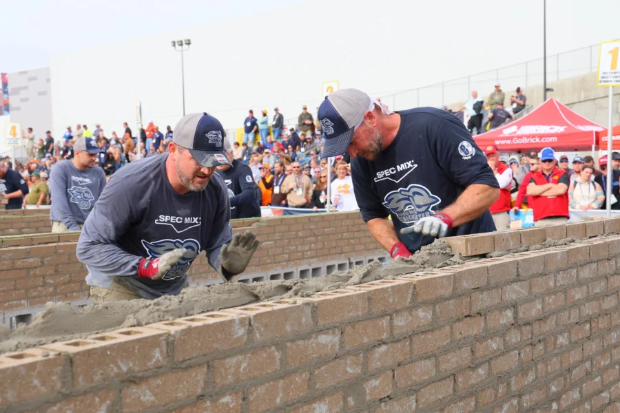 Competitors laying bricks during the SPEC MIX competition at World of Concrete in 2026